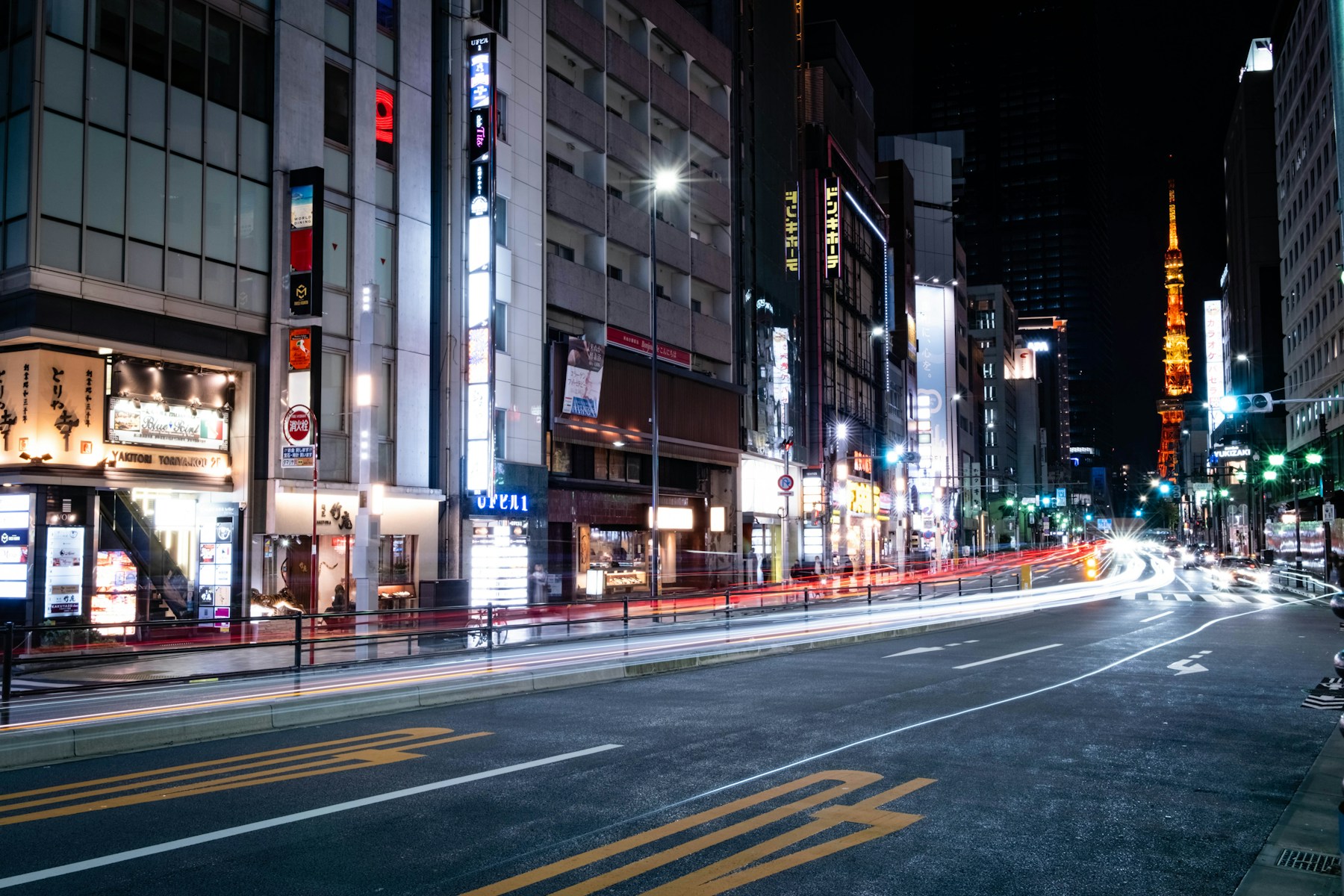 An illuminated Tokyo shopping street at night